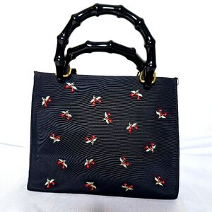 Vender brand "The Cherry Bomb" Dark Academia core bag.